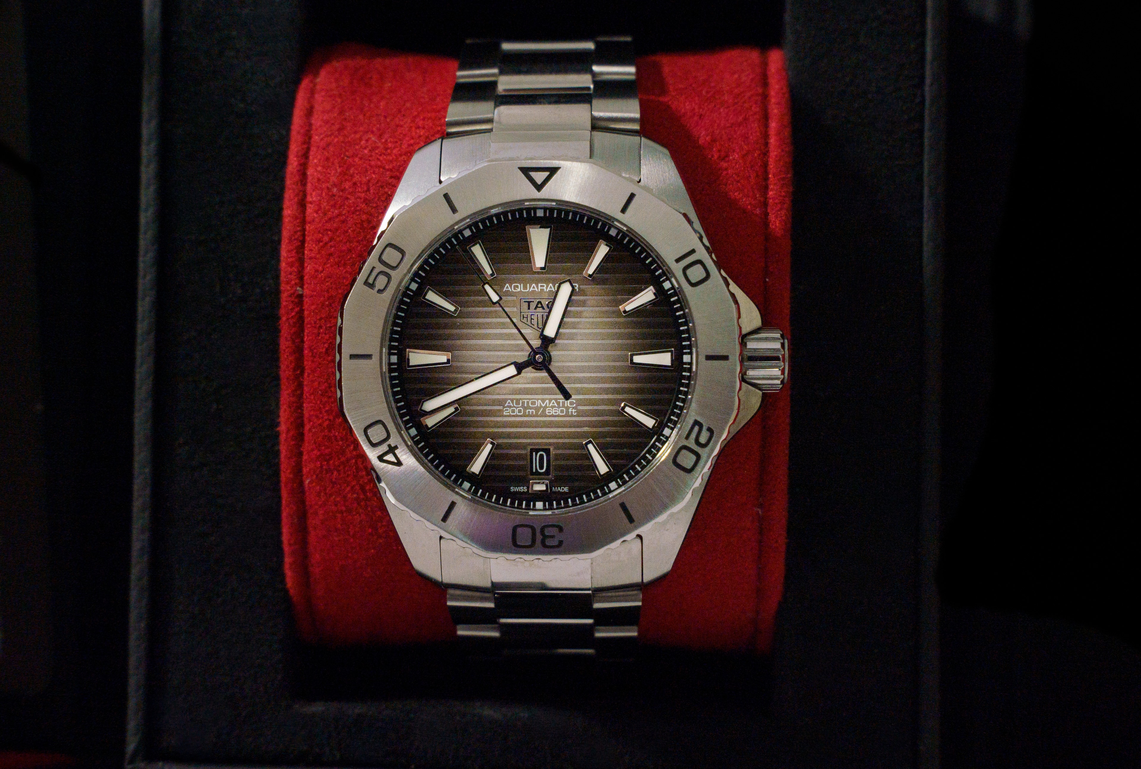 Luxury watch in its red case